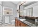 Updated bathroom boasts granite countertop and traditional wood cabinetry at 5638 Hereford Dr, New Port Richey, FL 34655