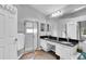 Bathroom featuring a double sink vanity, walk-in shower, and ample storage space at 5638 Hereford Dr, New Port Richey, FL 34655