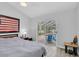 Bright bedroom with ceiling fan and sliding glass doors to pool area at 5638 Hereford Dr, New Port Richey, FL 34655