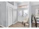Welcoming foyer with decorative glass double doors, transom window, and neutral decor for a bright, open feel at 5638 Hereford Dr, New Port Richey, FL 34655
