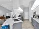 Open-concept kitchen featuring a large island, stainless steel appliances, and seamless flow to the living area at 5638 Hereford Dr, New Port Richey, FL 34655