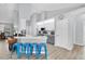 Modern kitchen featuring stainless steel appliances, white cabinetry, and a breakfast bar at 5638 Hereford Dr, New Port Richey, FL 34655