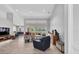 Bright and airy living room features an open layout, modern decor, and seamless flow to the dining area and kitchen at 5638 Hereford Dr, New Port Richey, FL 34655