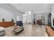 Spacious living room showcasing an open floor plan, stylish furnishings, and abundant natural light from large windows at 5638 Hereford Dr, New Port Richey, FL 34655