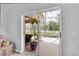 View from inside the home to a patio featuring a seating area and a beautiful in-ground pool at 5638 Hereford Dr, New Port Richey, FL 34655
