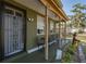 Inviting porch with outdoor seating and charming decor, enhancing the home's curb appeal at 6146 Ashland Dr, Spring Hill, FL 34606