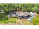 Aerial shot showcasing a charming single-story home with inviting front porch and spacious yard at 6203 Sumter Dr, Brooksville, FL 34602