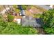 An aerial view of a home featuring mature trees, a large backyard and a detached garage at 6203 Sumter Dr, Brooksville, FL 34602