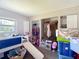 This room features a closet, a bed with a slide, and a window for natural light at 6203 Sumter Dr, Brooksville, FL 34602