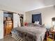 Bedroom featuring comfortable bed, a storage dresser, and a window at 6203 Sumter Dr, Brooksville, FL 34602