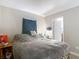 Bedroom showcasing neutral walls and a comfortable bed with natural light from the window at 6203 Sumter Dr, Brooksville, FL 34602