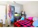 Bedroom featuring hardwood floors and a closet with clothes and storage space at 6203 Sumter Dr, Brooksville, FL 34602