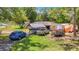An outdoor shot shows a driveway with ample parking space for cars, boats, and trailers at 6203 Sumter Dr, Brooksville, FL 34602
