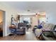 Cozy living area featuring hardwood floors, two recliners, and neutral paint at 6203 Sumter Dr, Brooksville, FL 34602