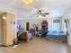 Spacious living room with laminate flooring and ample natural light, seamlessly connected to the kitchen at 6203 Sumter Dr, Brooksville, FL 34602
