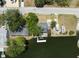 Waterfront home featuring canal access with a dock and boat parking space, lush trees, and a well-maintained yard at 6521 Boatyard Dr, Hudson, FL 34667