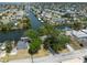 Waterfront community featuring canal access with docks, lush trees, and well-maintained homes at 6521 Boatyard Dr, Hudson, FL 34667