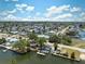 Waterfront community featuring canal access with docks and boat parking spaces, lush trees, and well-maintained homes at 6521 Boatyard Dr, Hudson, FL 34667