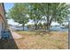 Backyard featuring waterfront views with mature trees and a grassy area to relax and enjoy canal at 6521 Boatyard Dr, Hudson, FL 34667