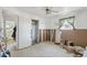 An incomplete bedroom features wall framing, a closet, and access to an adjacent room, needing complete renovation at 6521 Boatyard Dr, Hudson, FL 34667