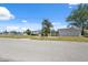 Street view of property with a detached garage and canal access, with boats ready for adventure at 6521 Boatyard Dr, Hudson, FL 34667