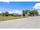 Street view of property with a detached garage and canal access, perfect for boating enthusiasts at 6521 Boatyard Dr, Hudson, FL 34667