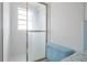 Bathroom featuring a shower with sliding glass door at 6611 Ridge Crest Dr, Port Richey, FL 34668