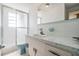 Bathroom featuring tiled shower and countertop vanity at 6611 Ridge Crest Dr, Port Richey, FL 34668