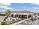 Coffee shop exterior featuring outdoor seating, lush landscaping, and a inviting atmosphere for customers at 6611 Ridge Crest Dr, Port Richey, FL 34668