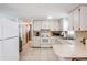 Well-lit kitchen with white appliances and ample counter space at 6611 Ridge Crest Dr, Port Richey, FL 34668