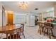 View of the kitchen, breakfast bar and adjacent living area at 6611 Ridge Crest Dr, Port Richey, FL 34668