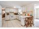 Cozy kitchen featuring a breakfast bar and tiled flooring at 6611 Ridge Crest Dr, Port Richey, FL 34668