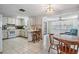 Open-concept kitchen area flowing into a dining space, perfect for entertaining at 6611 Ridge Crest Dr, Port Richey, FL 34668
