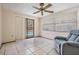 Bright room with tile floors and sliding door access to screened pool area at 6611 Ridge Crest Dr, Port Richey, FL 34668
