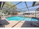 Screened-in pool offers plenty of space for outdoor recreation and relaxation at 6611 Ridge Crest Dr, Port Richey, FL 34668