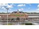 Shopping center featuring a Publix, bakery, and pharmacy with ample parking and well-maintained landscaping at 6611 Ridge Crest Dr, Port Richey, FL 34668