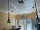 Bright dining area with decorative lighting, sliding glass doors, and a view of the backyard at 7144 Gulf Breeze Cir, Hudson, FL 34667