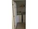 Functional laundry room equipped with a washer, dryer, and storage shelf for cleaning supplies at 7144 Gulf Breeze Cir, Hudson, FL 34667