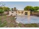 Well-maintained backyard with a concrete patio and a landscaped area, perfect for relaxing outdoors at 7235 Astor Dr, New Port Richey, FL 34652