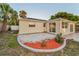 Backyard featuring white rock landscaping and a patio area, complete with lush greenery at 7235 Astor Dr, New Port Richey, FL 34652