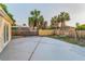 Expansive concrete patio area in the backyard with a swing set for play at 7235 Astor Dr, New Port Richey, FL 34652