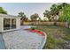 Backyard featuring white rock landscaping, a concrete patio, a swing set, and a new fence at 7235 Astor Dr, New Port Richey, FL 34652