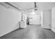 Clean basement with washer, dryer, utility sink, and water heater, ready for use at 7235 Astor Dr, New Port Richey, FL 34652