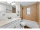Bright bathroom featuring a shower and tub combination with a vanity and tiled backsplash at 7235 Astor Dr, New Port Richey, FL 34652