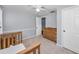 Cozy bedroom with soft carpet, wooden furniture and ceiling fan at 7235 Astor Dr, New Port Richey, FL 34652