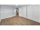 Spacious bedroom featuring wood flooring and closet at 7235 Astor Dr, New Port Richey, FL 34652