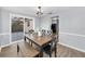 The dining area features a modern table, chairs, and bench seating at 7235 Astor Dr, New Port Richey, FL 34652