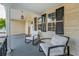 Relaxing front porch featuring two armchairs and a decorative 'welcome' sign at 7235 Astor Dr, New Port Richey, FL 34652