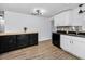 The kitchen has a wooden breakfast bar and black appliances at 7235 Astor Dr, New Port Richey, FL 34652