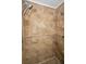 Detail of the bathroom shower with tiled walls and multiple shower heads at 7235 Astor Dr, New Port Richey, FL 34652